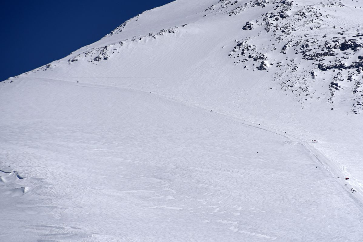 14C Many Climbers Descending The Traverse Morning From Garabashi Camp On Mount Elbrus Climb